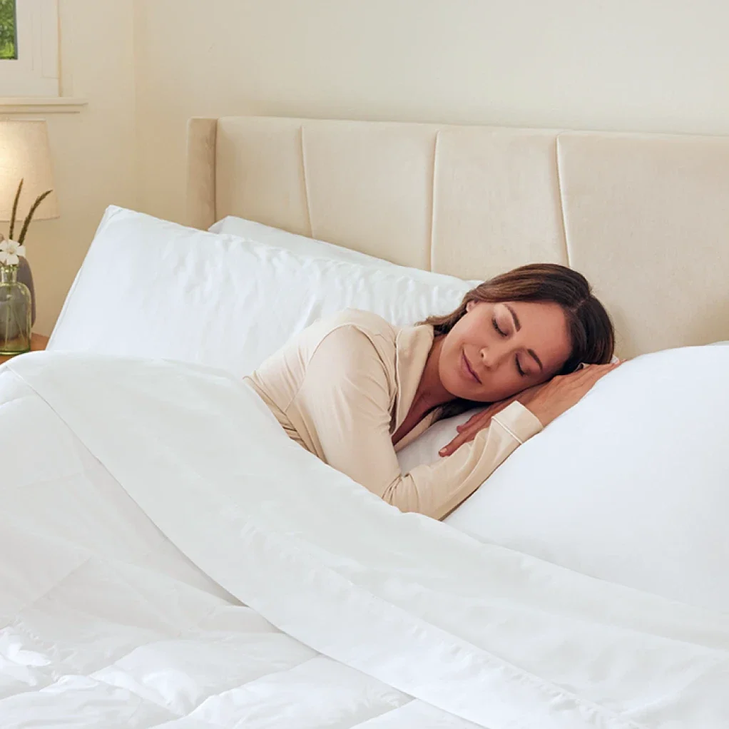 Woman sleeping peacefully with Miracle Bed Sheets